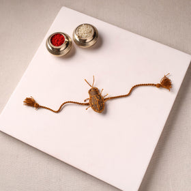 Cockroach - Reusable Handmade Threadwork Rakhi with Potli 06
