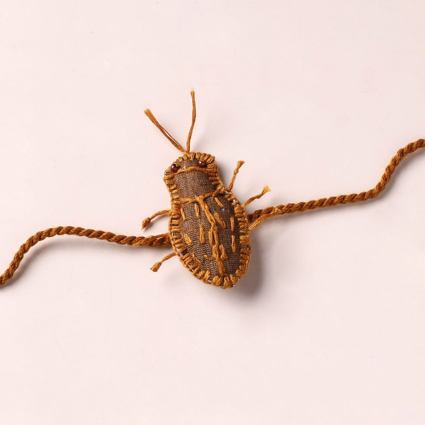Cockroach - Reusable Handmade Threadwork Rakhi with Potli 06
