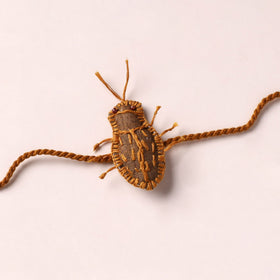 Cockroach - Reusable Handmade Threadwork Rakhi with Potli 06