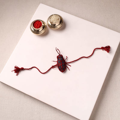 Cockroach - Reusable Handmade Threadwork Rakhi with Potli 07