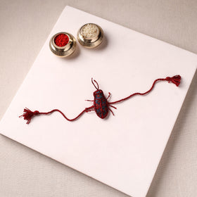 Cockroach - Reusable Handmade Threadwork Rakhi with Potli 07