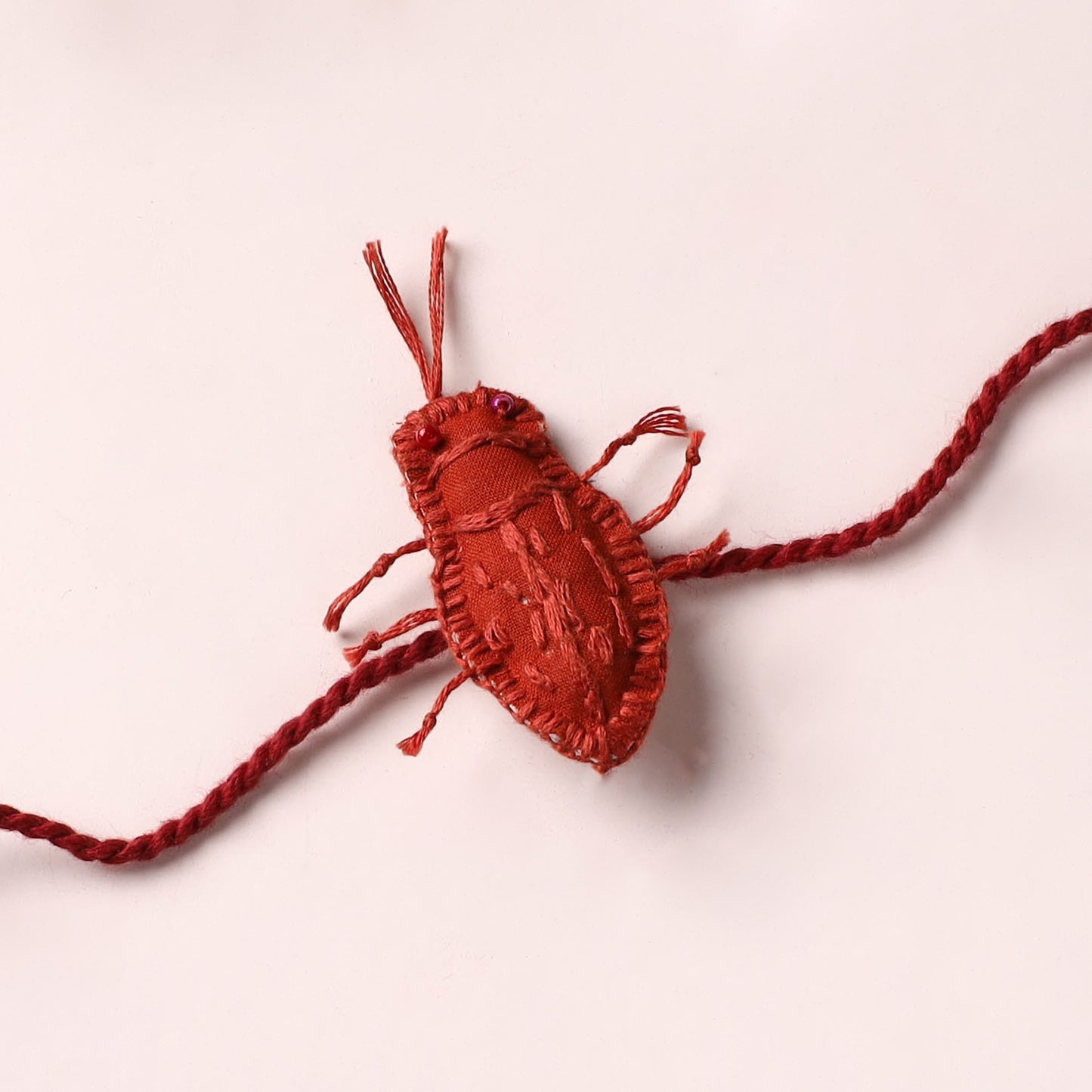 Cockroach - Reusable Handmade Threadwork Rakhi with Potli 08