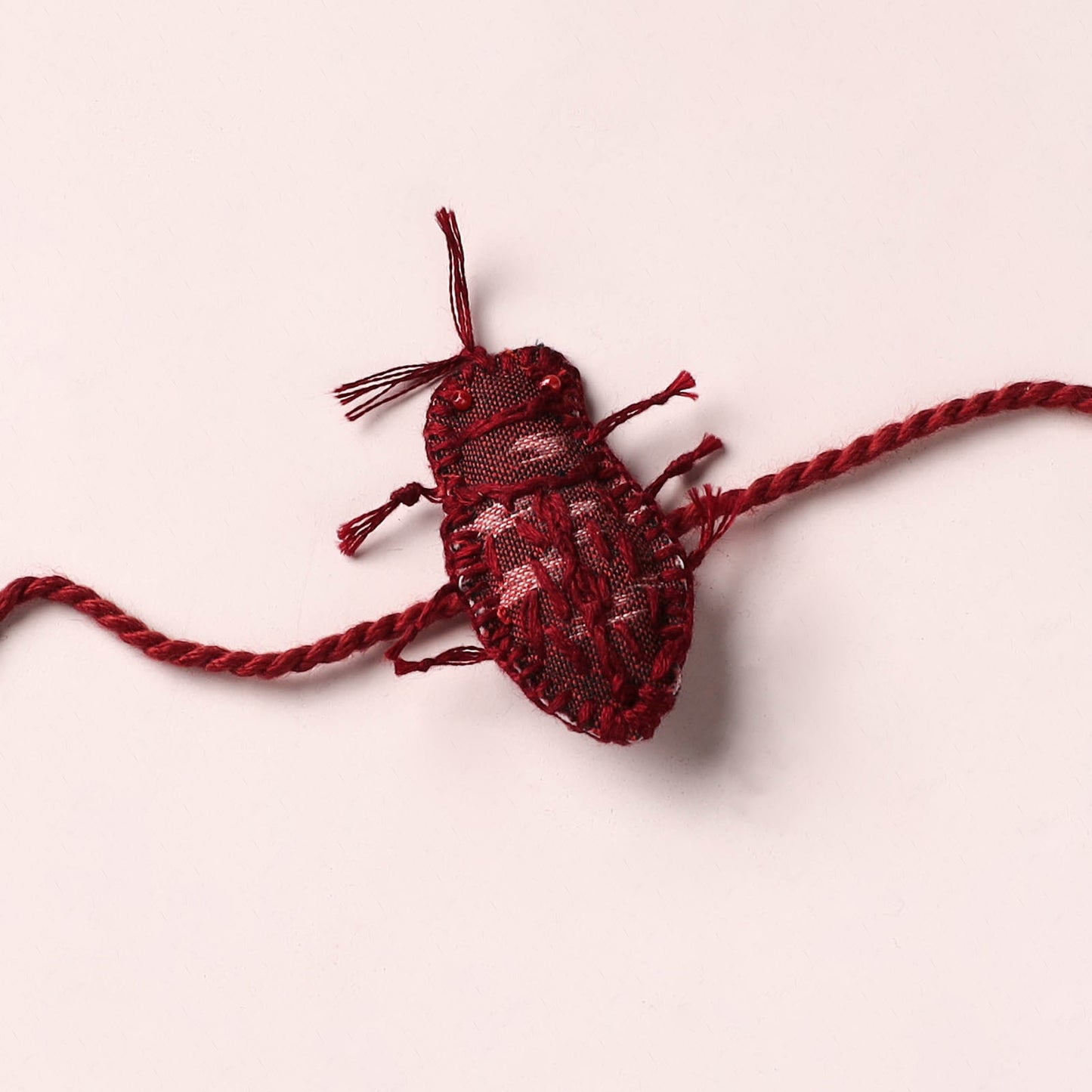 Cockroach - Reusable Handmade Threadwork Rakhi with Potli 09