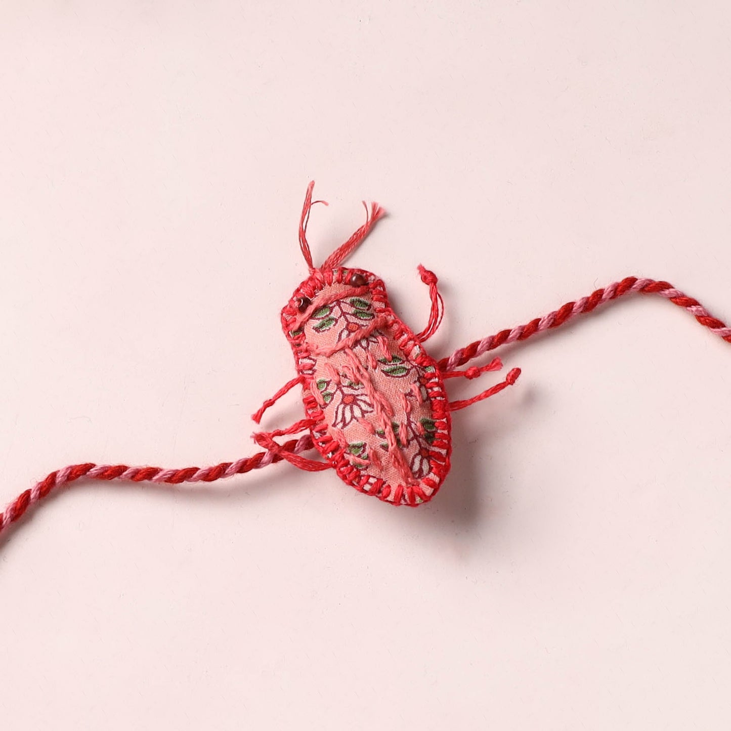 Cockroach - Reusable Handmade Threadwork Rakhi with Potli  12