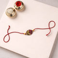 Pattachitra Handpainted Wooden Rakhi 02