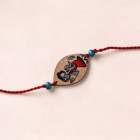 Pattachitra Handpainted Wooden Rakhi 09