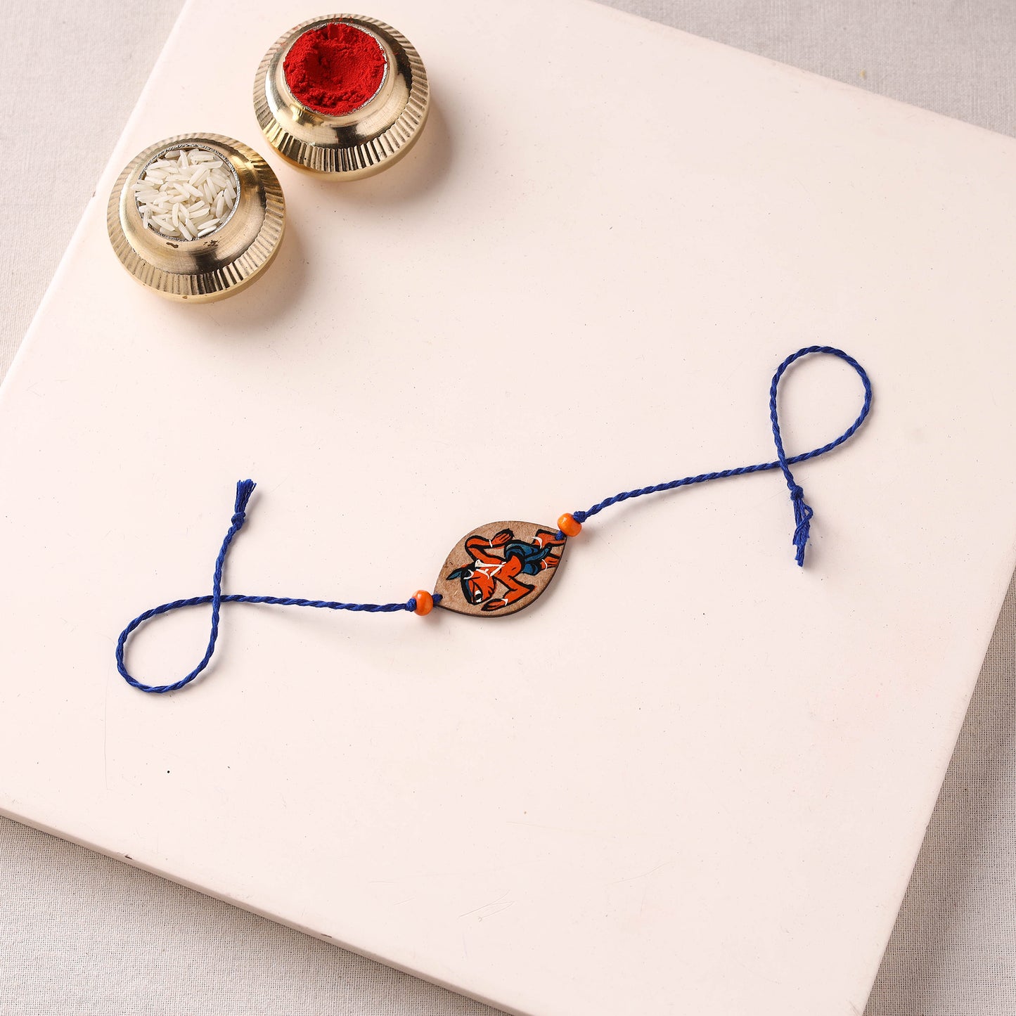 Pattachitra Handpainted Wooden Rakhi 15