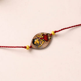 Pattachitra Handpainted Wooden Rakhi 17