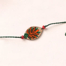 Pattachitra Handpainted Wooden Rakhi 26