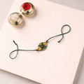 Pattachitra Handpainted Wooden Rakhi 30