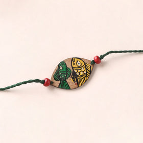 Pattachitra Handpainted Wooden Rakhi 36