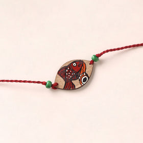 Pattachitra Handpainted Wooden Rakhi 40
