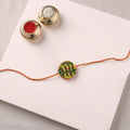 Manjusha Art Handpainted Resin Rakhi 03