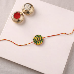 Reusable Manjusha Art Handpainted Resin Rakhi with Potli 03