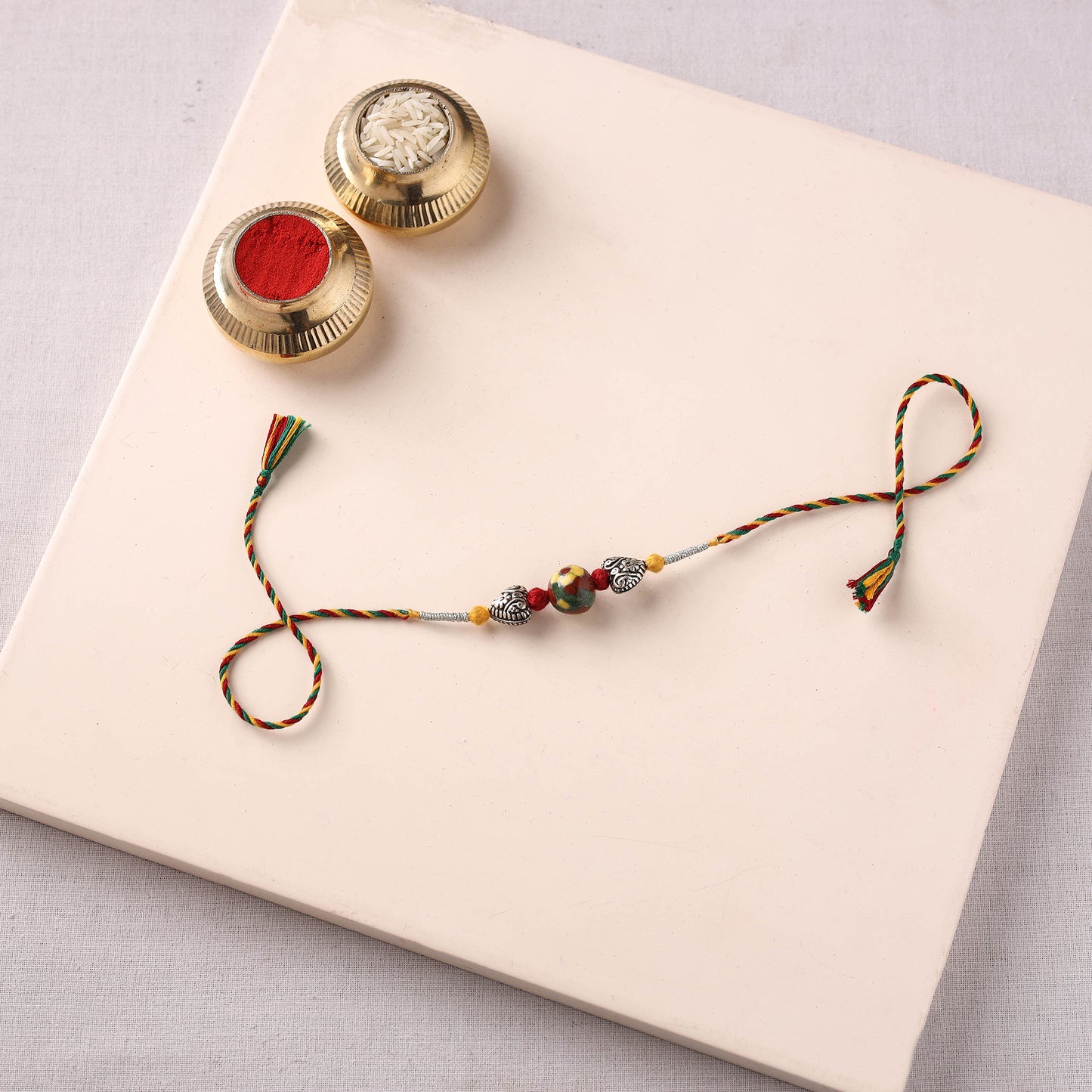 Handcrafted Patwa Threadwork Blue Pottery Beads Rakhi 01