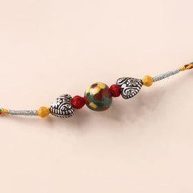 Handcrafted Patwa Threadwork Blue Pottery Beads Rakhi 01