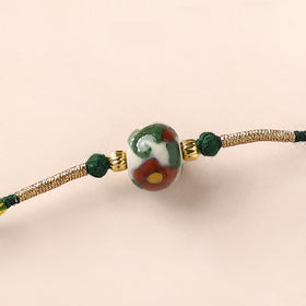 Handcrafted Patwa Threadwork Blue Pottery Beads Rakhi 08
