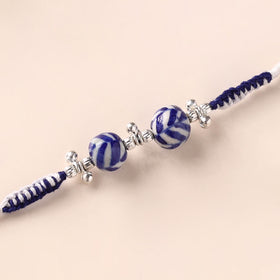 Handcrafted Patwa Threadwork Blue Pottery Beads Rakhi 09