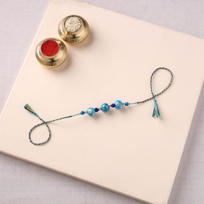 Handcrafted Patwa Threadwork Blue Pottery Beads Rakhi 11