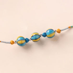 Handcrafted Patwa Threadwork Blue Pottery Beads Rakhi 13
