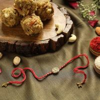 Dokra Brass Rakhi with Dry Fruit Laddu
