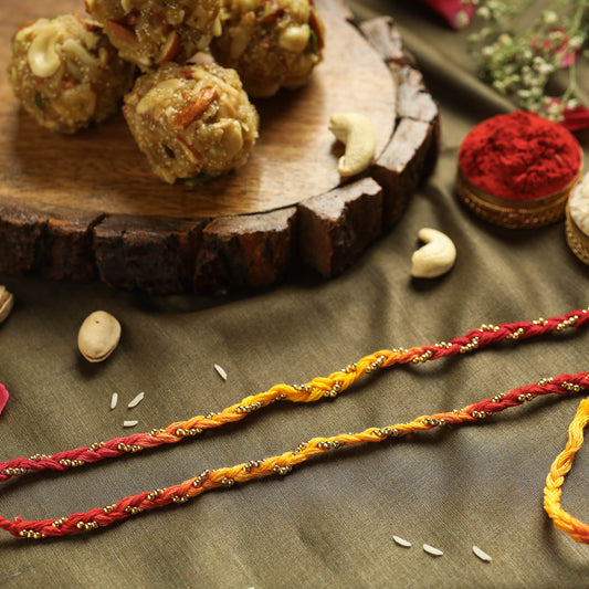 Gold Beads Rakhi (Set of 2) with Dry Fruit Laddu