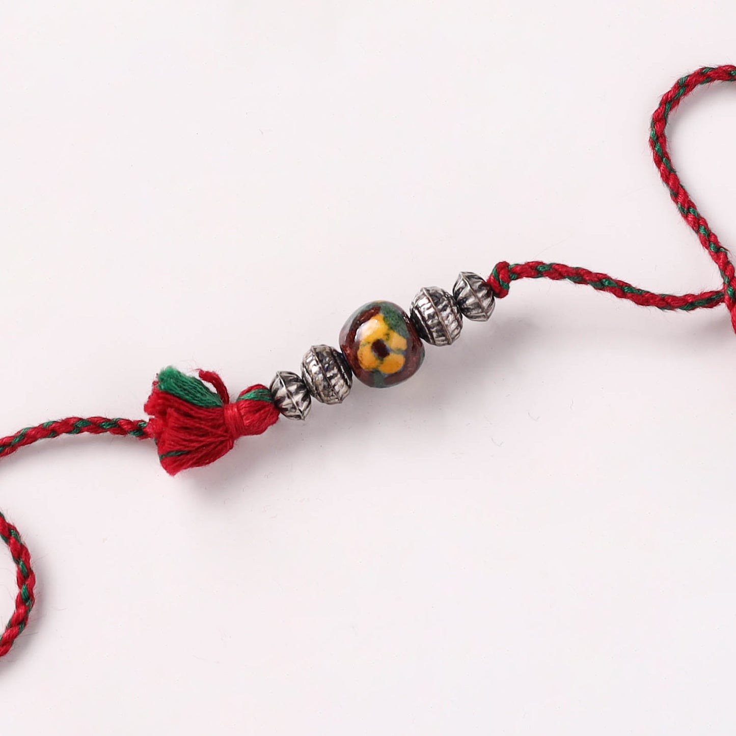 Handcrafted Patwa Threadwork Blue Pottery Beads Rakhi with Potli 03