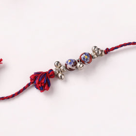 Handcrafted Patwa Threadwork Blue Pottery Beads Rakhi with Potli 06
