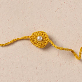 Handmade Crochet Pearl Work Rakhi 12