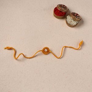 Handmade Crochet Pearl Work Rakhi 25