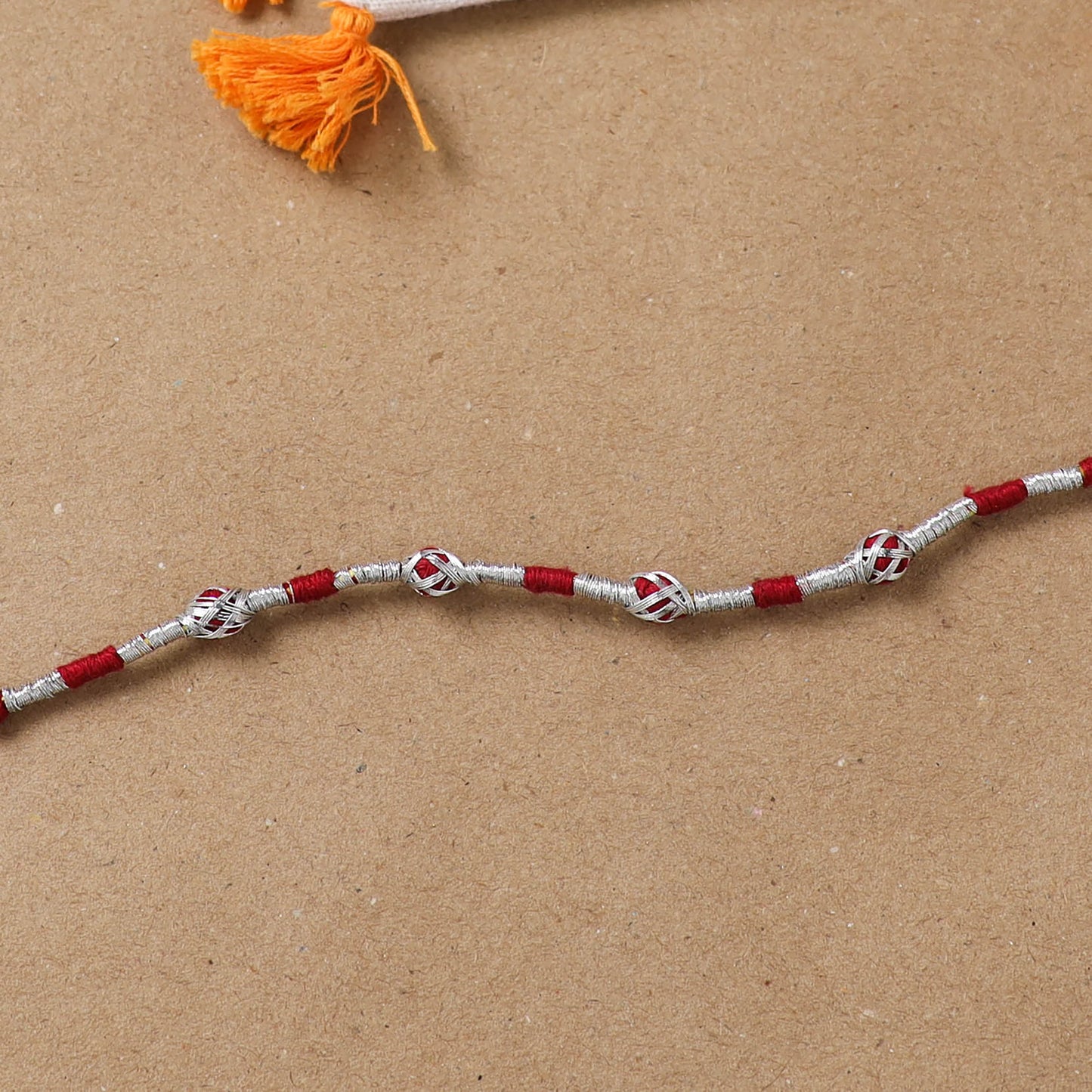 Anant Raksha Thread Work Rakhi with Soof Hand Embroidered Potli 01
