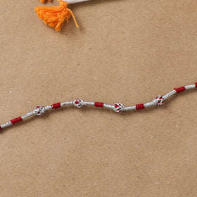 Anant Raksha Thread Work Rakhi with Soof Hand Embroidered Potli 01