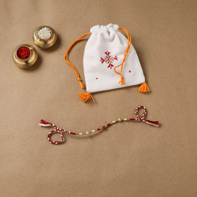 Anant Raksha Thread Work Rakhi with Soof Hand Embroidered Potli 03