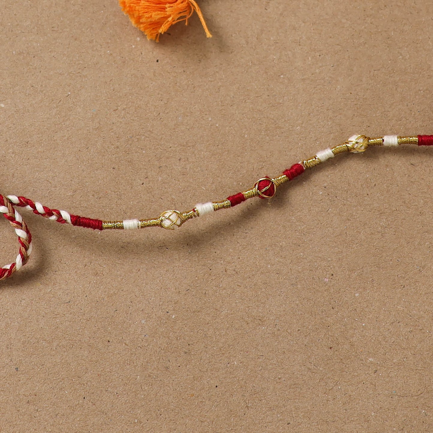 Anant Raksha Thread Work Rakhi with Soof Hand Embroidered Potli 03