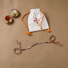 Anant Raksha Thread Work Rakhi with Soof Hand Embroidered Potli 04