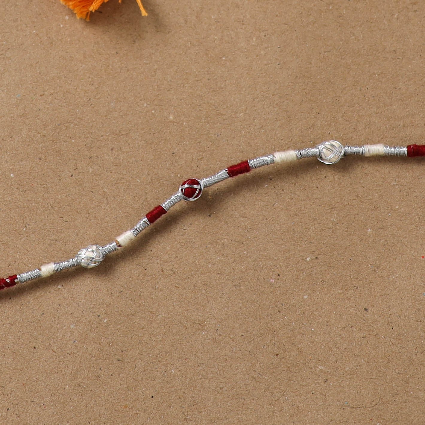 Anant Raksha Thread Work Rakhi with Soof Hand Embroidered Potli 04