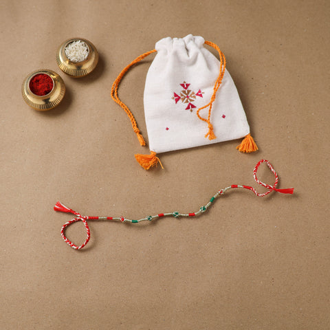 Anant Raksha Thread Work Rakhi with Soof Hand Embroidered Potli 08