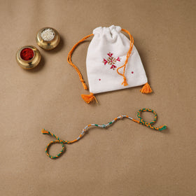 Anant Raksha Thread Work Rakhi with Soof Hand Embroidered Potli 09