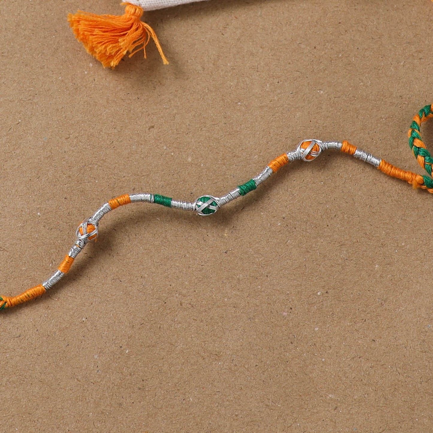 Anant Raksha Thread Work Rakhi with Soof Hand Embroidered Potli 09