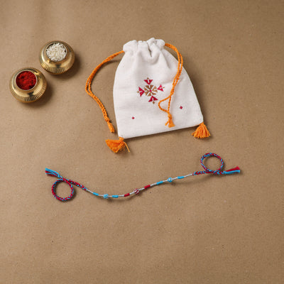 Anant Raksha Thread Work Rakhi with Soof Hand Embroidered Potli 10