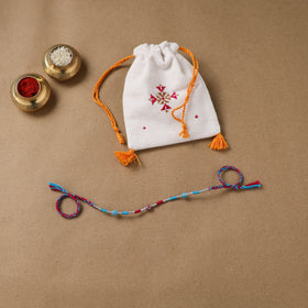 Anant Raksha Thread Work Rakhi with Soof Hand Embroidered Potli 10