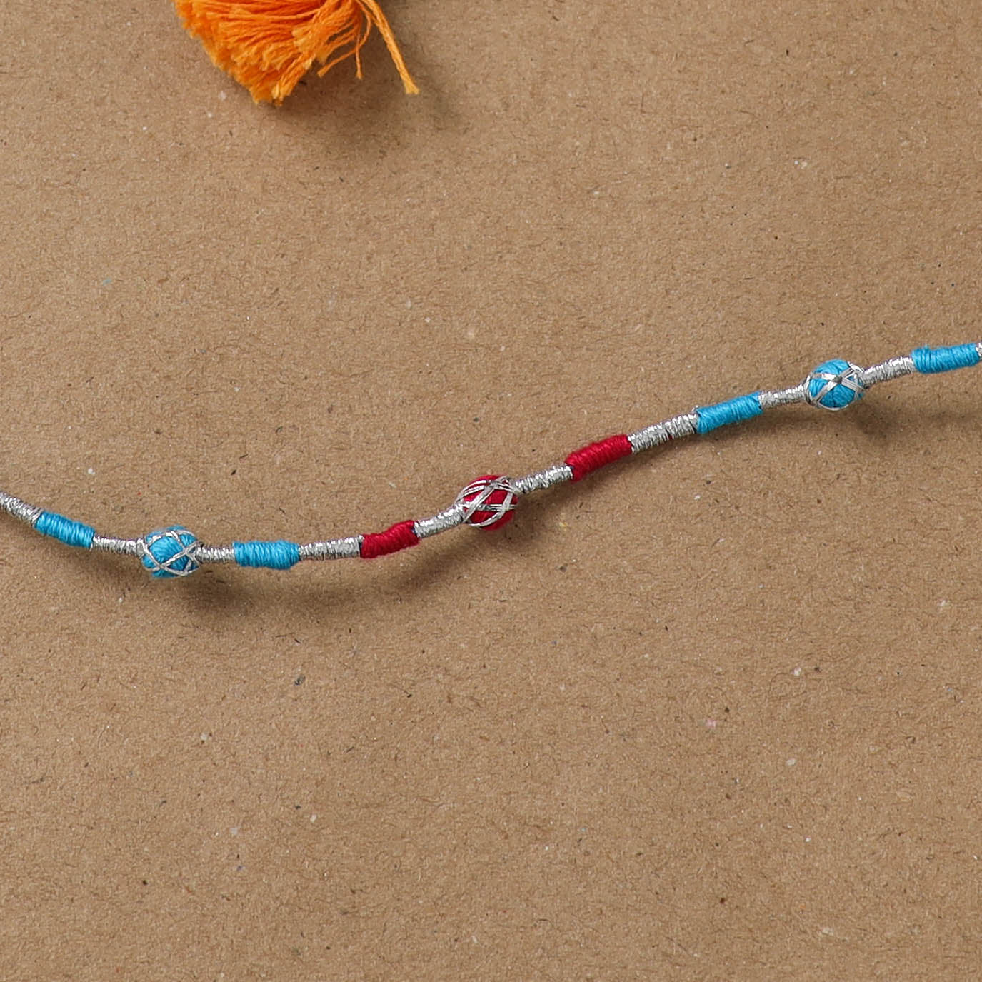 Anant Raksha Thread Work Rakhi with Soof Hand Embroidered Potli 10