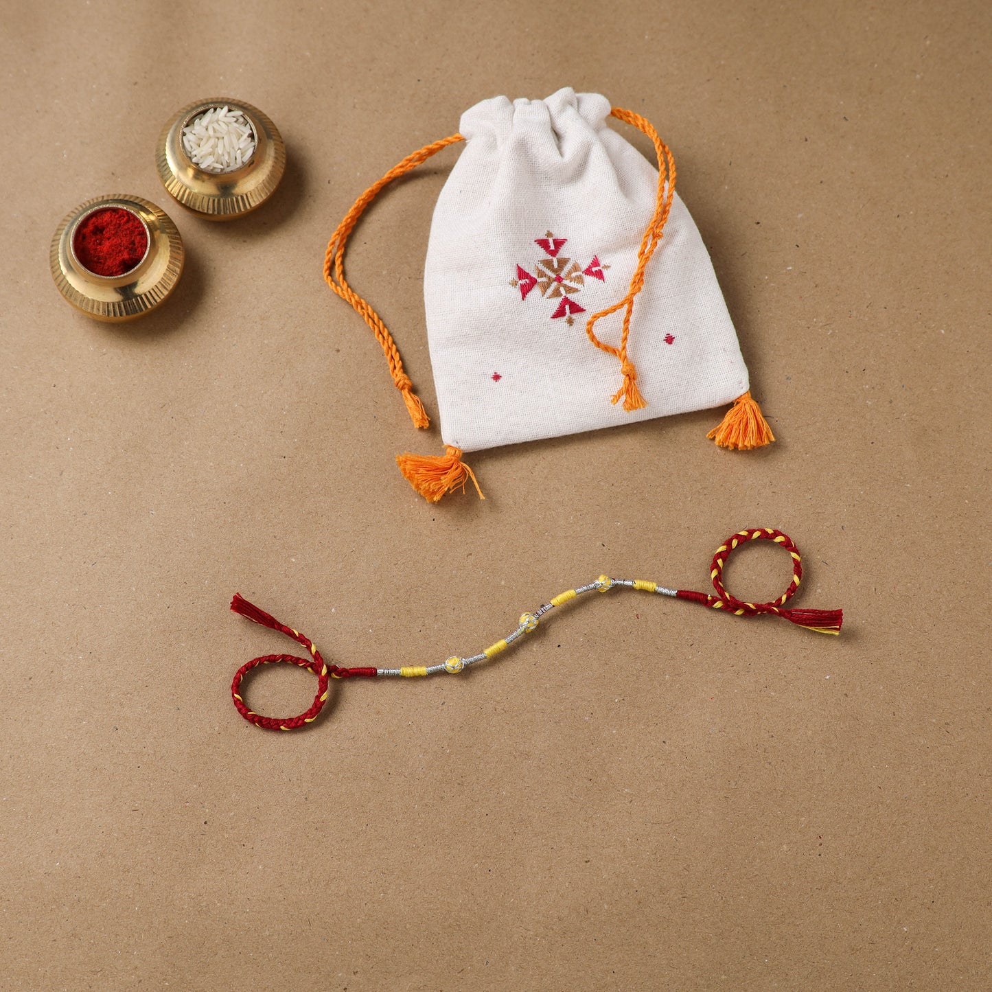 Anant Raksha Thread Work Rakhi with Soof Hand Embroidered Potli 11