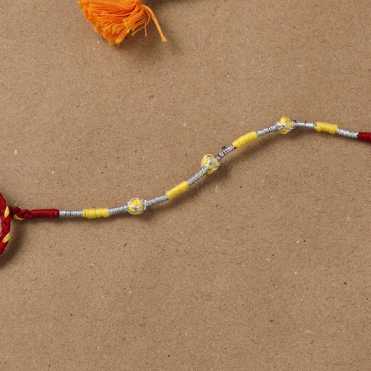Anant Raksha Thread Work Rakhi with Soof Hand Embroidered Potli 11