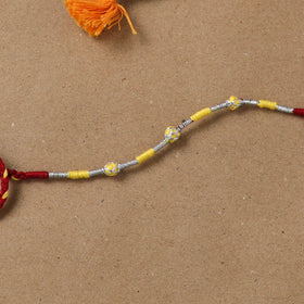 Anant Raksha Thread Work Rakhi with Soof Hand Embroidered Potli 11
