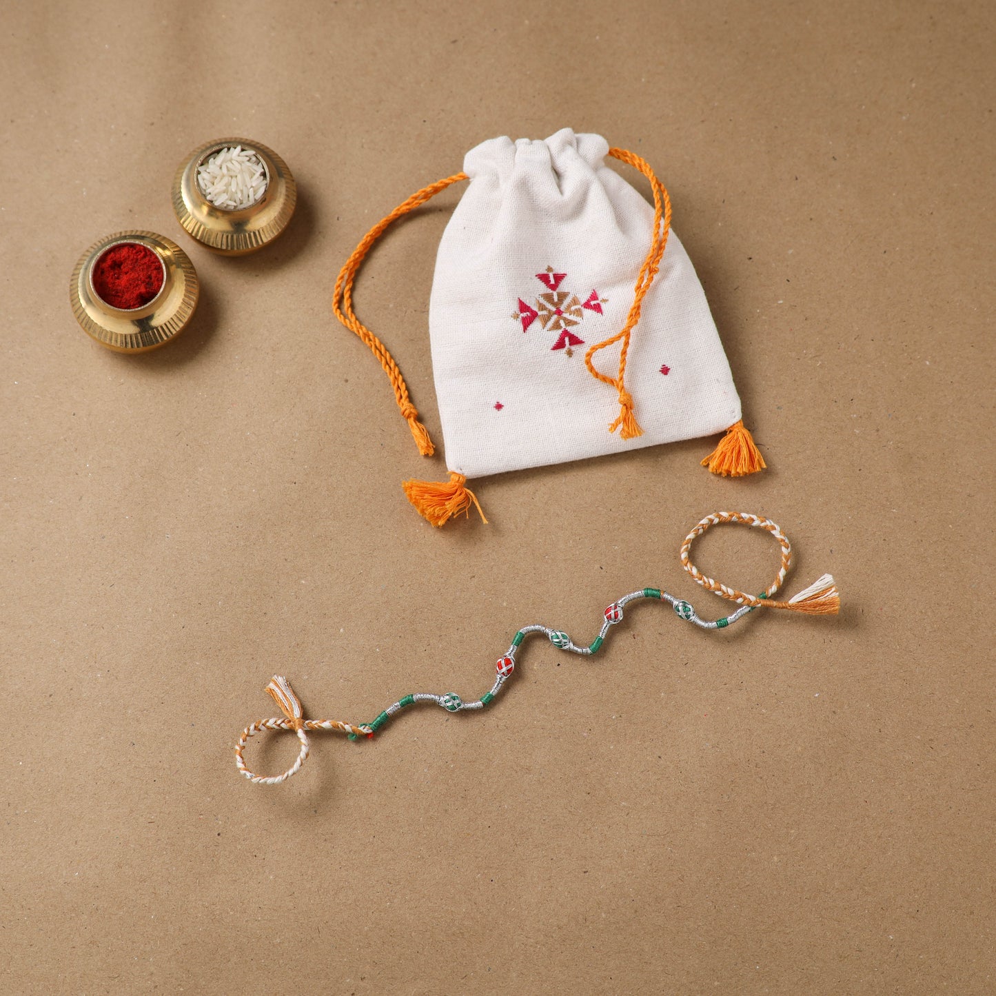 Anant Raksha Thread Work Rakhi with Soof Hand Embroidered Potli 12