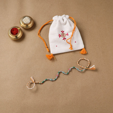 Anant Raksha Thread Work Rakhi with Soof Hand Embroidered Potli 12