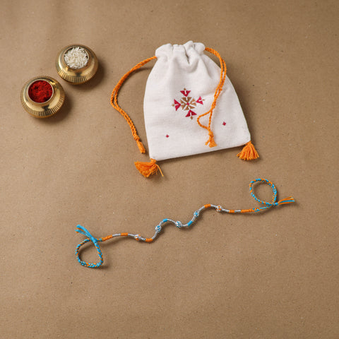 Anant Raksha Thread Work Rakhi with Soof Hand Embroidered Potli 13