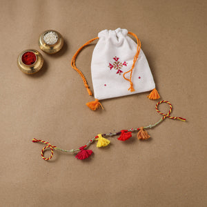Anant Raksha Thread Work Rakhi with Soof Hand Embroidered Potli 17