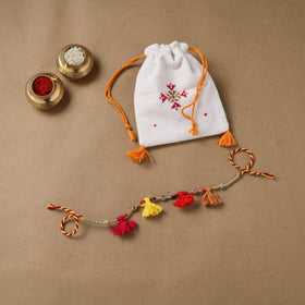 Anant Raksha Thread Work Rakhi with Soof Hand Embroidered Potli 17